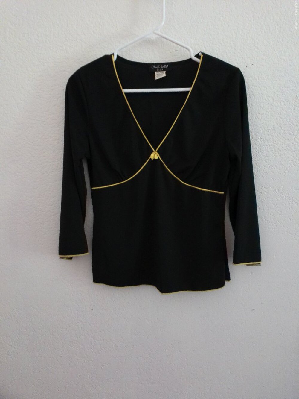 Club SoDA, black long sleeve top, V-neck, with little yellow color design